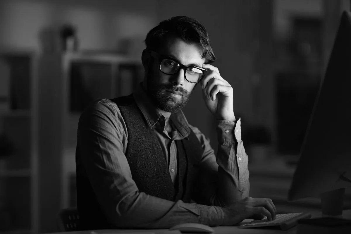A person sitting at a desk in front of a computer